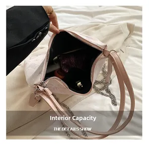 Detailed view of the chain tote bag internal capacity showing daily makeup storage