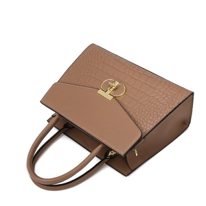 Brown faux leather handbag with crocodile texture and golden metal ring buckle closure