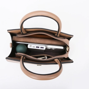 Brown faux leather handbag with spacious multi-compartment interior for daily essentials