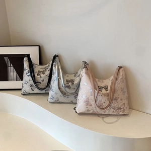 Fashion butterfly print tote bag in white, silver, and pink with metal bow decor