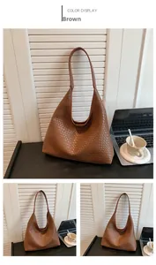 Close-up of brown woven faux leather tote bag showing textured hobo style and large capacity
