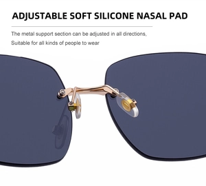 Macro shot of adjustable soft silicone nose pads on rimless clover sunglasses with gold metal