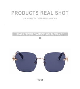 Detail of rimless sunglasses with gold hinges and clover-shaped diamond embellishments