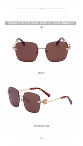 Detail of rimless sunglasses featuring clover diamond embellishment and gold metal temples