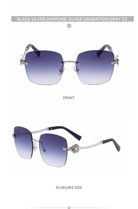 Detail of rimless sunglasses with rhinestone flower accent and gradient gray lenses
