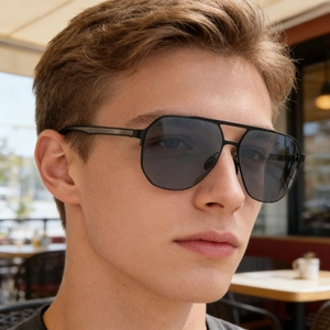 Detail of square polarized sunglasses with dark grey lenses and metal temple accents