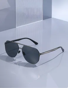 Detail view of square pilot sunglasses with grey metal frame and striped temple design