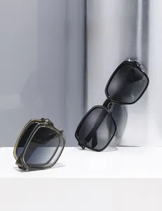 Close-up of square polarized sunglasses showing both open and compact folded states