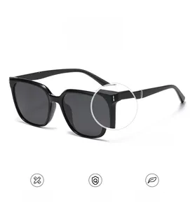 Detailed macro view showing the durable alloy hinge components of oversized black sunglasses
