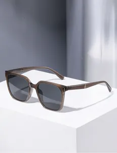Close-up of translucent amber square frame sunglasses with silver hinge metal accents