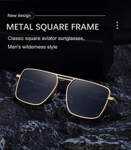 Detail shot of square pilot sunglasses with gold metal frame and double bridge on rock