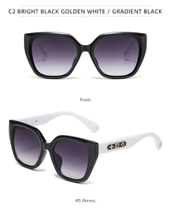 Detailed view of cat eye sunglasses featuring gold floral patterns on contrast temples