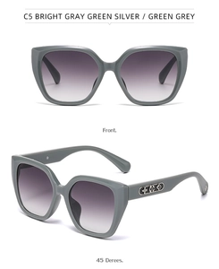 Detail of sage green butterfly sunglasses with floral metal hollow design on temples