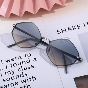 Chic irregular hexagonal sunglasses with gradient lenses on a fashion magazine background