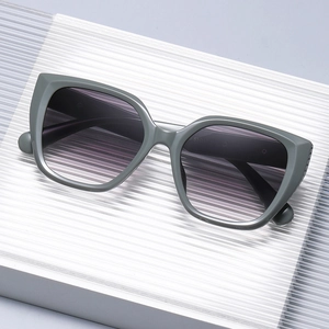 Fashionable grey cat-eye sunglasses with gradient lenses for women in a modern style