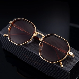 2025 trendy polygonal sunglasses with gold metal frame and gradient lenses on black case