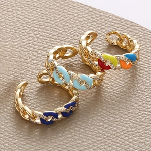 Detail of adjustable chain rings with colorful enamel finishes and micro-inlaid zircons