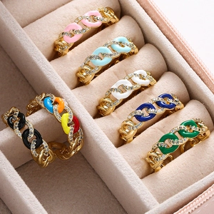 Macro detail of colorful enamel Cuban link rings set with micro-inlaid cubic zirconia