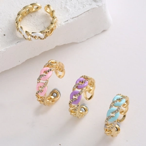 Detail of adjustable chain rings with macaron enamel colors and micro-set cubic zirconia