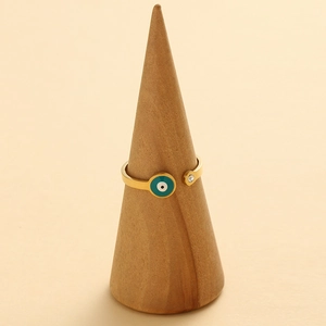 Bague ouverte en acier doré avec œil en émail turquoise et détail en zircone