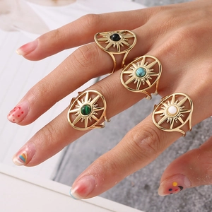 Set of four gold stainless steel bohemian open rings with colorful stones and star sun design