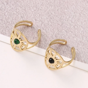 Set of two gold open rings featuring green and black gemstones with sunburst texture