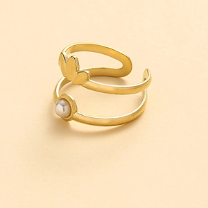 Detail of a gold double-layered adjustable ring featuring a small pearl and petal design