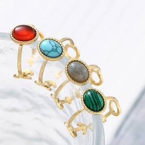 Gold stainless steel oval natural stone rings in turquoise, red, and malachite green colors