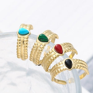 Set of four adjustable teardrop stone rings in gold finish with wavy relief texture
