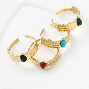 Detailed view of bohemian teardrop rings with unique wavy texture in four vibrant colors