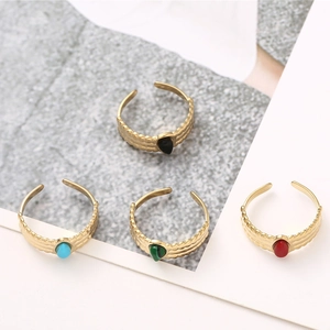 Set of four teardrop stone rings in vintage gold with wavy textured adjustable bands