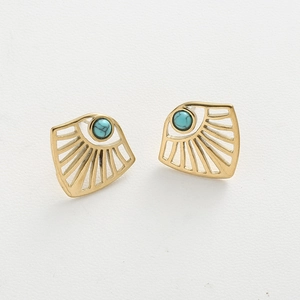 Macro shot of fan-shaped cutout earrings with natural turquoise stone and gold plating