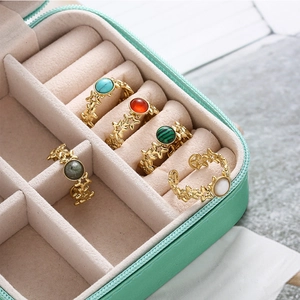 Bohemian open star rings in five colors with natural stone accents in a mint jewelry box