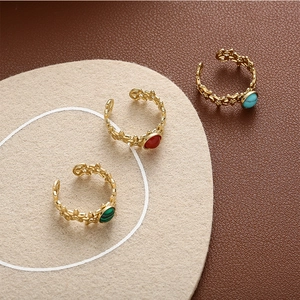 Detail of vintage gold-plated rings featuring star patterns and natural stones