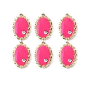 Set of 6 pink enamel oval pendants with gold scalloped edges and a single clear rhinestone