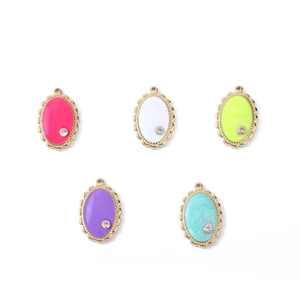 Detail of colorful enamel water drop pendants with small rhinestones and gold base
