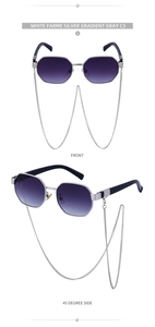 Close-up of polygon sunglasses with purple gradient lenses and silver metal chain