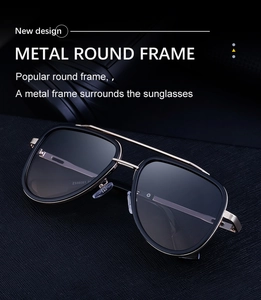 Detail of vintage double bridge sunglasses with matte black and gold metal frames