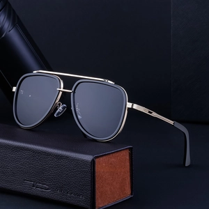 Classic aviator sunglasses with gold double bridge frames on luxury leather case