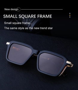 Close-up of matte black square frame sunglasses with golden triple-bar metal accents