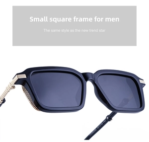 Detail of retro square sunglasses featuring golden woven texture on the black temples