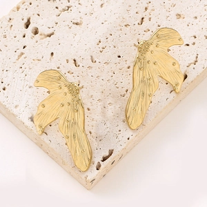 Irregular gold leaf earrings with French pleated texture and metallic bead accents