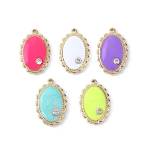 Detail of colorful oval drip oil pendants with gold scalloped edges and tiny zircons