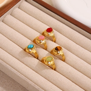 Detailed view of 5-piece bohemian vintage ring set with assorted natural stone inlays