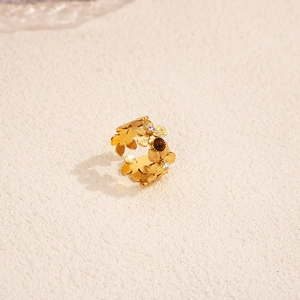 Detail of 18k gold plated floral ring featuring cubic zirconia and tiger eye stone