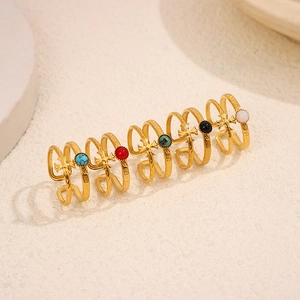 Detail of 18K gold plated double-layer cross rings with colorful gemstone accents