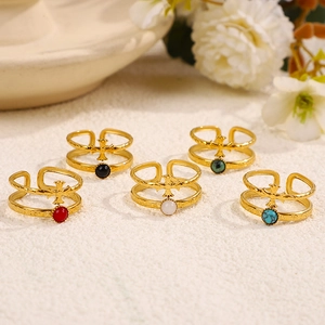 Detail of 18K gold plated double-layer cross ring with colorful gemstone beads