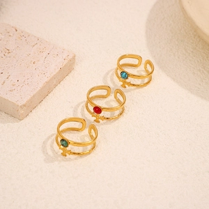 Close-up of 18K gold double-layer cross rings with inlaid turquoise and colorful stones