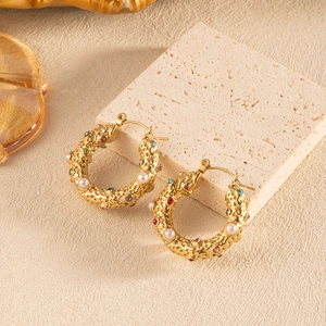 U-shaped gold hoop earrings with textured lava finish, pearls and colorful zircons