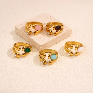 Detailed set of five vintage gold-plated rings featuring colorful natural stones and zircons